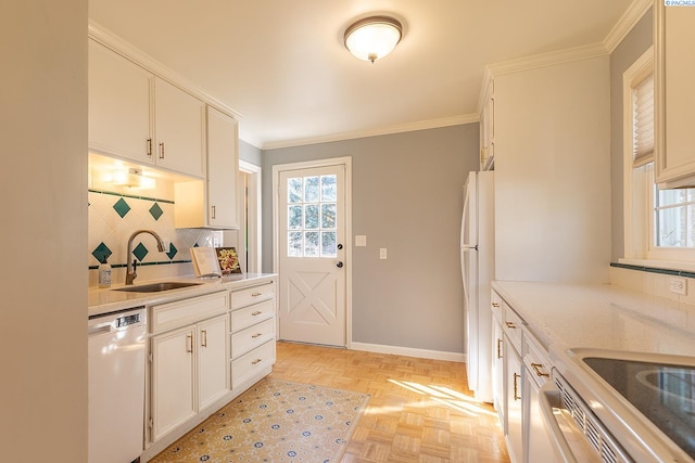 525 SE Water St, Pullman, WA 99163 - kitchen featuring white appliances, ornamental molding, light countertops, a sink, and decorative backsplash
