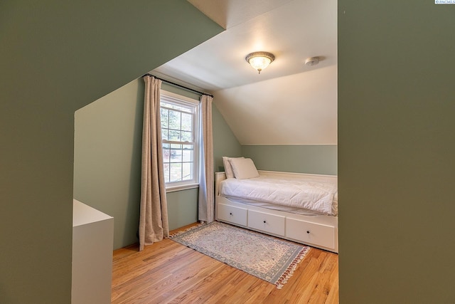 525 SE Water St, Pullman, WA 99163 - bedroom featuring vaulted ceiling and wood finished floors