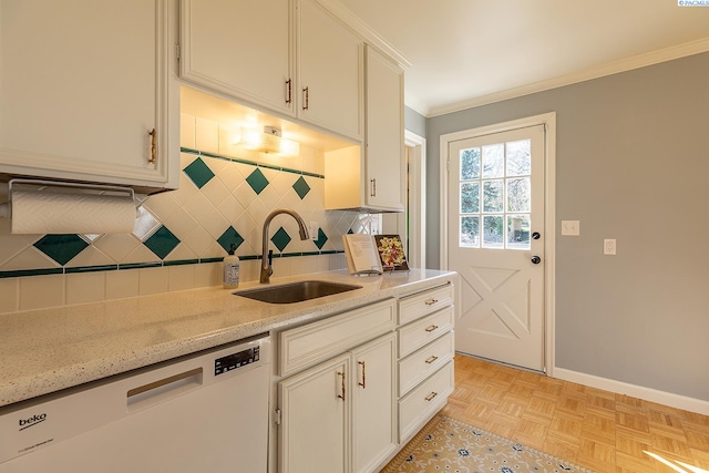 525 SE Water St, Pullman, WA 99163 - kitchen with baseboards, white dishwasher, a sink, crown molding, and backsplash