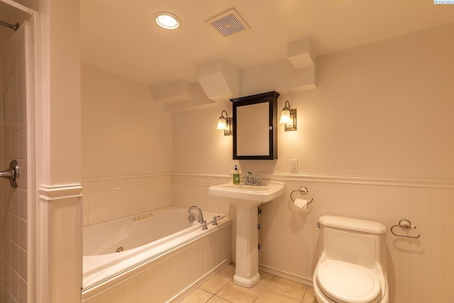 525 SE Water St, Pullman, WA 99163 - full bath featuring tile patterned floors, toilet, visible vents, a bath, and wainscoting