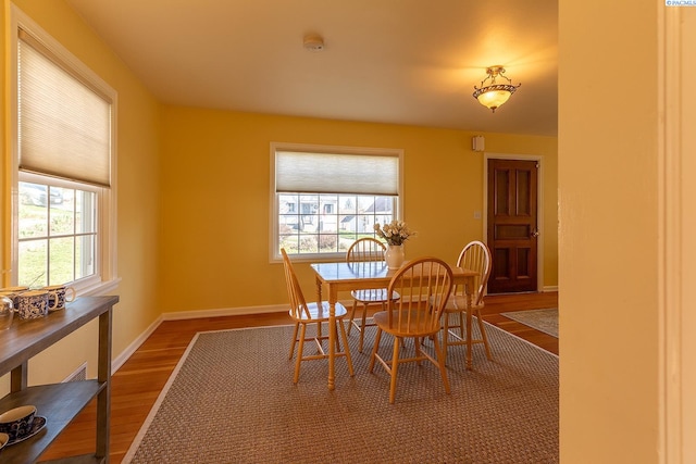 525 SE Water St, Pullman, WA 99163 - dining space with baseboards and dark wood-style floors