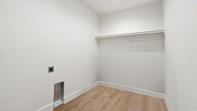 215 E Oak St, Walla Walla, WA 99362 - laundry area featuring hookup for an electric dryer, light wood-style floors, laundry area, and baseboards
