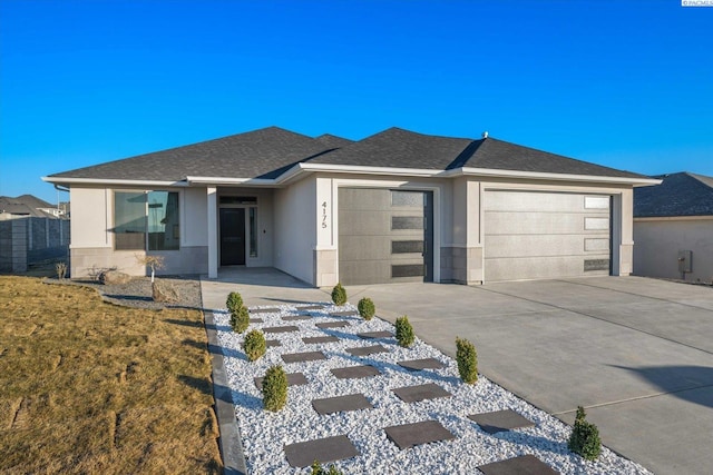 prairie-style house featuring a garage