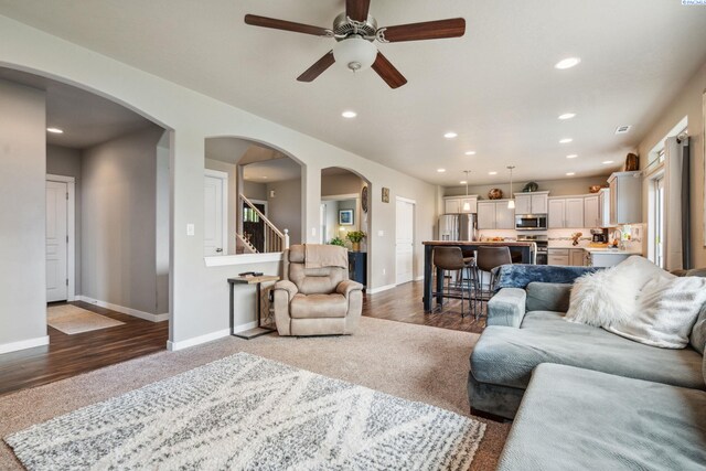 2855 S Dawes Pl, Kennewick, WA 99338 - carpeted living room with stairs, a ceiling fan, baseboards, and recessed lighting