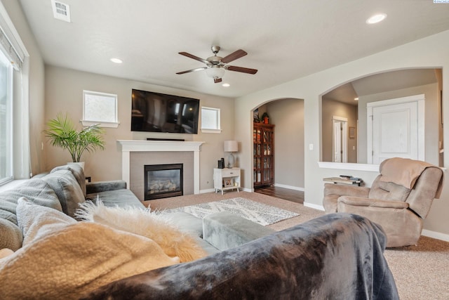 2855 S Dawes Pl, Kennewick, WA 99338 - carpeted living room featuring arched walkways, ceiling fan, visible vents, and recessed lighting