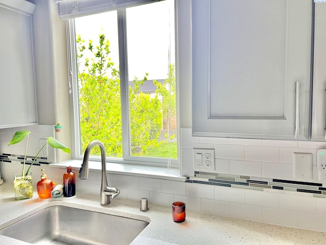 2855 S Dawes Pl, Kennewick, WA 99338 - details featuring light stone counters, a sink, and tasteful backsplash