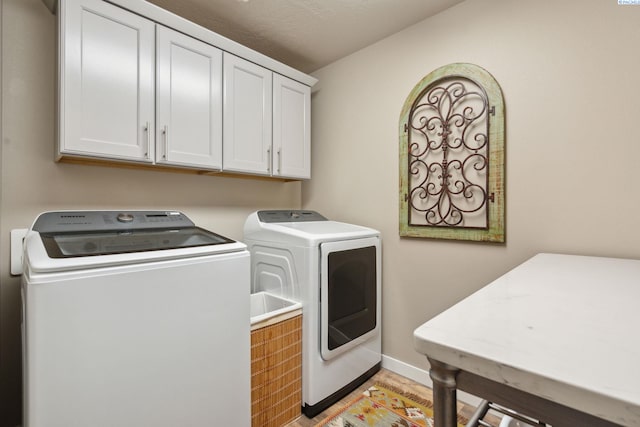 2855 S Dawes Pl, Kennewick, WA 99338 - laundry room featuring baseboards, cabinet space, and washer and dryer