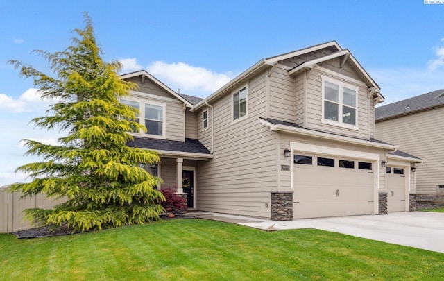 2855 S Dawes Pl, Kennewick, WA 99338 - craftsman-style home with roof with shingles, stone siding, a garage, a front yard, and concrete driveway