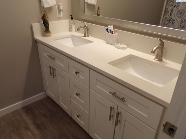 166214 W Johnson Rd, Prosser, WA 99350 - full bathroom featuring double vanity and wood finished floors