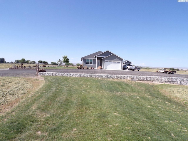 166214 W Johnson Rd, Prosser, WA 99350 - view of grassy yard with a garage and driveway