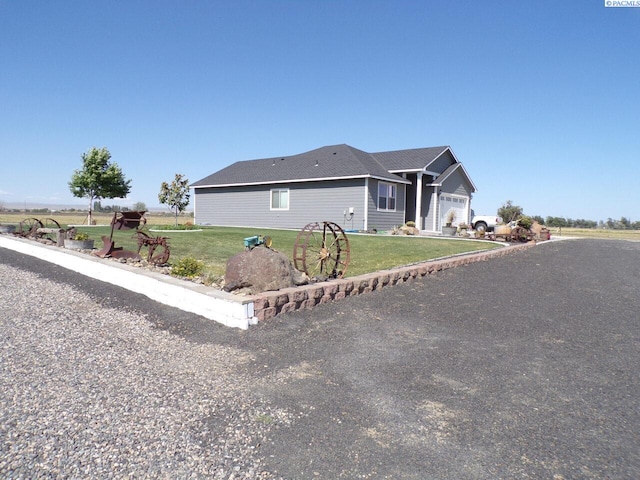 166214 W Johnson Rd, Prosser, WA 99350 - single story home with a front lawn