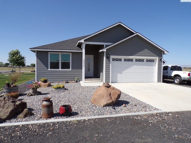 166214 W Johnson Rd, Prosser, WA 99350 - single story home featuring an attached garage, driveway, and a shingled roof