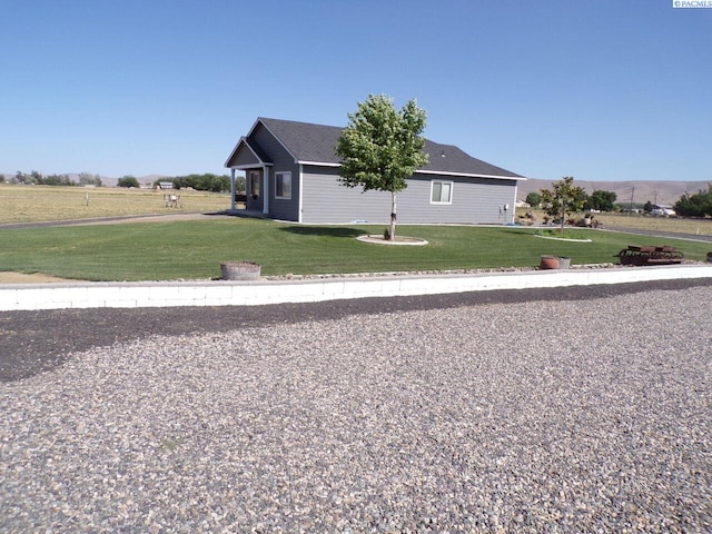 166214 W Johnson Rd, Prosser, WA 99350 - view of side of property with a lawn