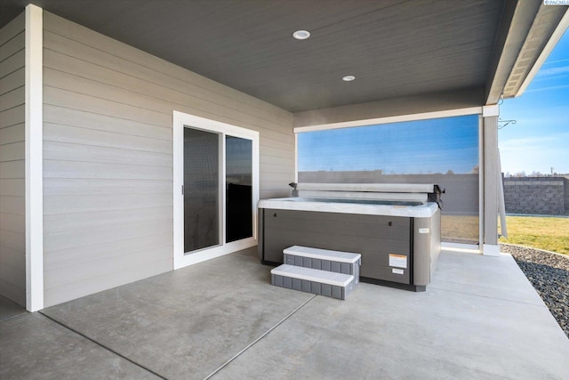 view of patio / terrace featuring a hot tub