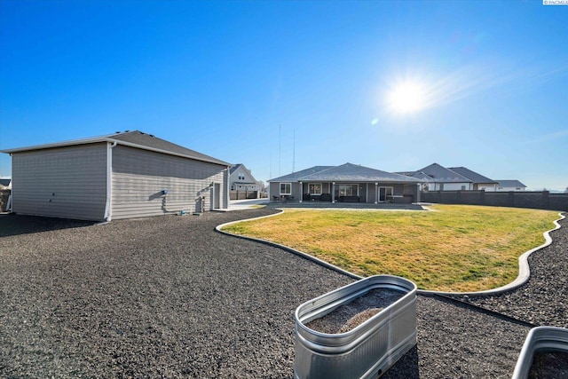 back of house featuring a yard