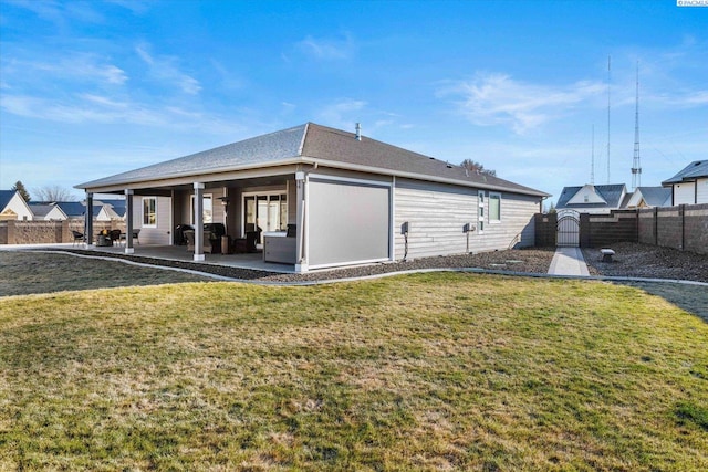 view of property exterior with a lawn and a patio area