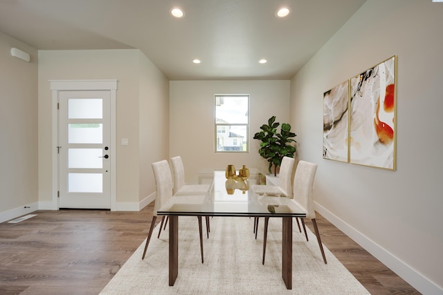 dining area featuring wood-type flooring