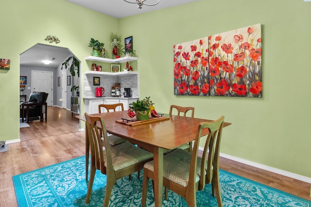 4500 S Dayton Ct, Kennewick, WA 99337 - dining space with light wood-type flooring, baseboards, and arched walkways