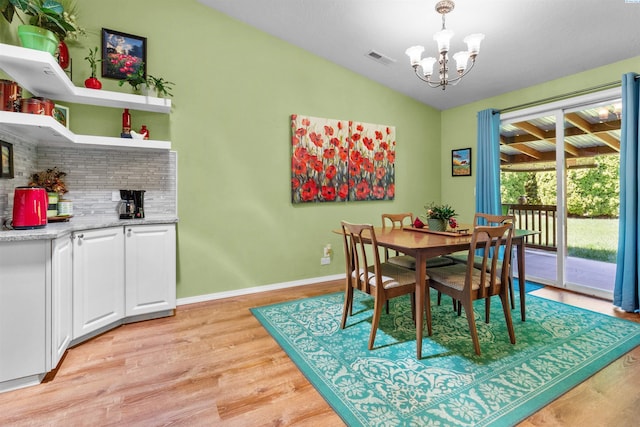 4500 S Dayton Ct, Kennewick, WA 99337 - dining space featuring a chandelier, light wood-type flooring, and baseboards