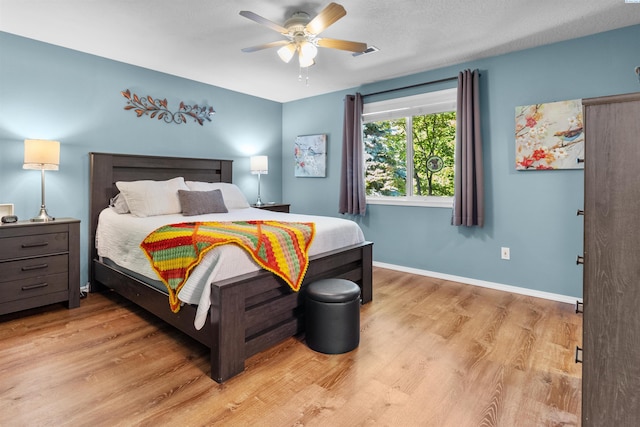 4500 S Dayton Ct, Kennewick, WA 99337 - bedroom with light wood finished floors, baseboards, and a ceiling fan