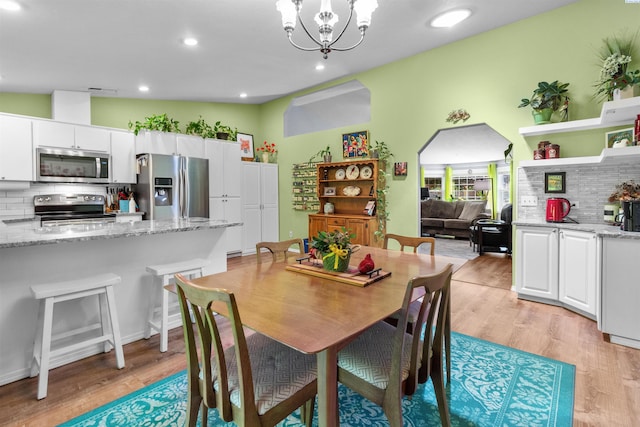 4500 S Dayton Ct, Kennewick, WA 99337 - dining room featuring light wood-style floors, a chandelier, and recessed lighting