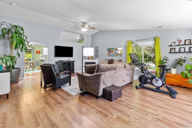 4500 S Dayton Ct, Kennewick, WA 99337 - living area featuring light wood finished floors, a ceiling fan, lofted ceiling, and arched walkways
