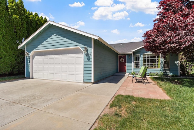 4500 S Dayton Ct, Kennewick, WA 99337 - ranch-style home featuring concrete driveway and a garage