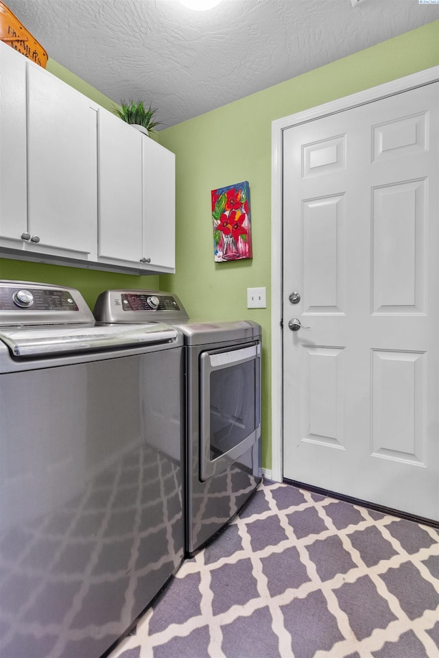 4500 S Dayton Ct, Kennewick, WA 99337 - laundry room with cabinet space, independent washer and dryer, and a textured ceiling