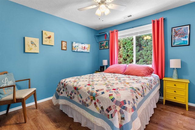 4500 S Dayton Ct, Kennewick, WA 99337 - bedroom with wood finished floors, baseboards, and a ceiling fan