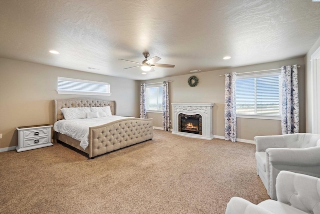 3011 S Dawes Pl, Kennewick, WA 99338 - bedroom with carpet flooring, baseboards, ceiling fan, recessed lighting, and a high end fireplace