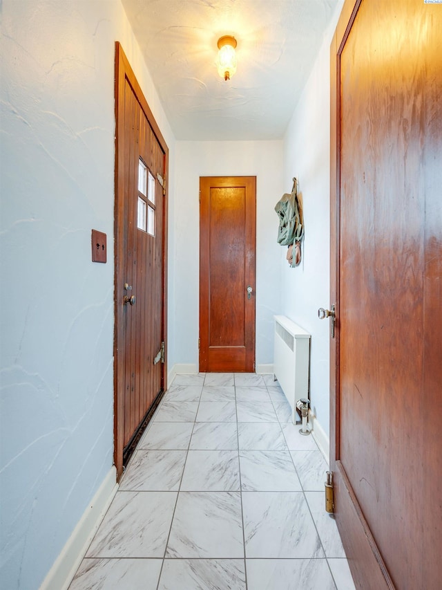 doorway featuring radiator heating unit