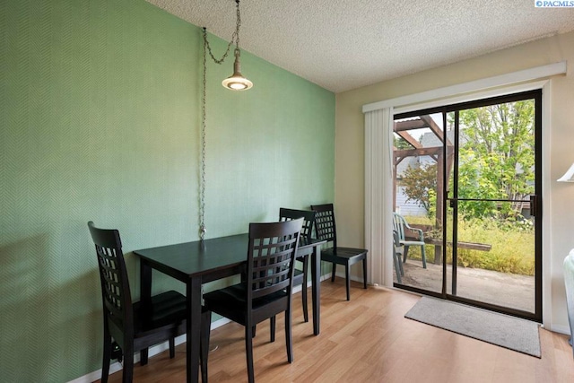 600 SW Crestview St Unit 22, Pullman, WA 99163 - dining area with wood finished floors and a textured ceiling