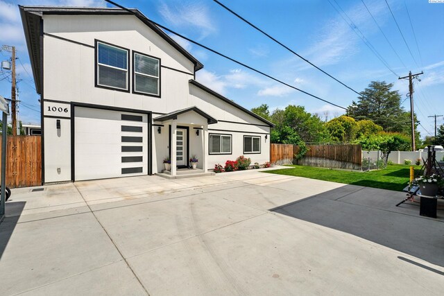 1006 Adams St, Richland, WA 99352 - view of front facade with concrete driveway and a garage