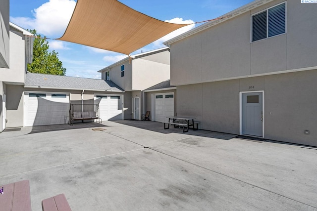 1006 Adams St, Richland, WA 99352 - view of patio with a garage and driveway