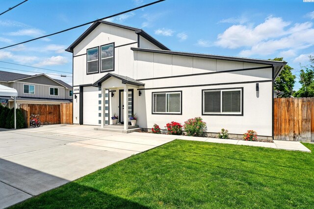 1006 Adams St, Richland, WA 99352 - view of front facade with a garage and concrete driveway