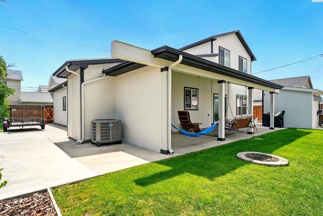 1006 Adams St, Richland, WA 99352 - back of property featuring a patio area, central air condition unit, and a fire pit