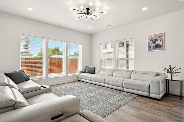 1006 Adams St, Richland, WA 99352 - living area with a chandelier, wood finished floors, recessed lighting, and baseboards