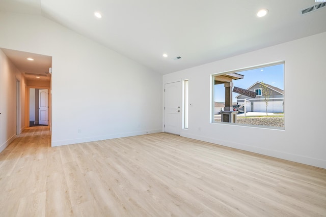2967 S Penn St, Kennewick, WA 99338 - unfurnished living room with light wood-style floors, lofted ceiling, baseboards, and recessed lighting