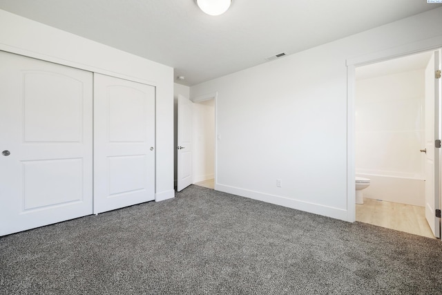 2967 S Penn St, Kennewick, WA 99338 - unfurnished bedroom featuring a closet, carpet floors, baseboards, and connected bathroom
