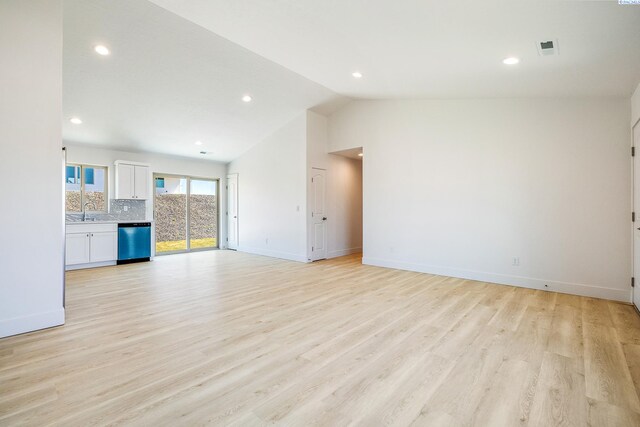 2967 S Penn St, Kennewick, WA 99338 - unfurnished living room featuring a sink, lofted ceiling, recessed lighting, baseboards, and light wood-style flooring