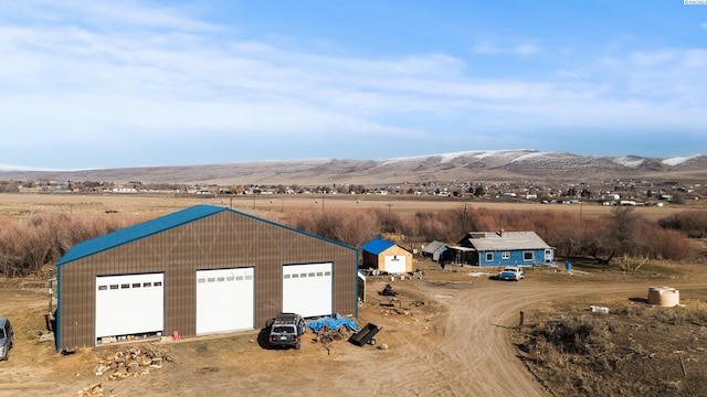 birds eye view of property featuring a mountain view