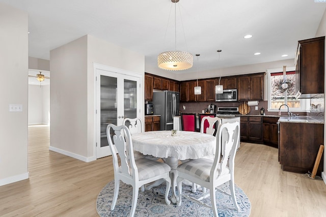 6013 Somerset Ln, Pasco, WA 99301 - dining area featuring light wood finished floors, baseboards, and recessed lighting