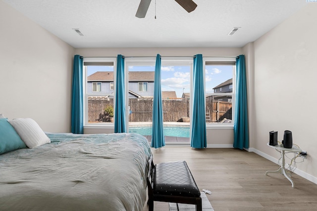 6013 Somerset Ln, Pasco, WA 99301 - bedroom featuring light wood-type flooring, baseboards, a ceiling fan, and access to outside
