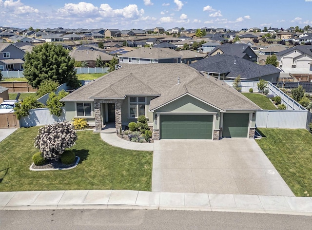 3512 El Paso Dr, Pasco, WA 99301 - view of front of home with stone siding, a garage, a residential view, and a shingled roof