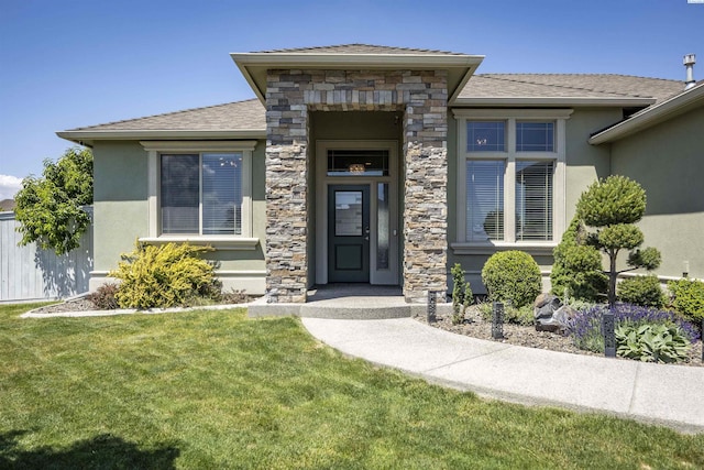 3512 El Paso Dr, Pasco, WA 99301 - property entrance with stucco siding, a yard, and stone siding