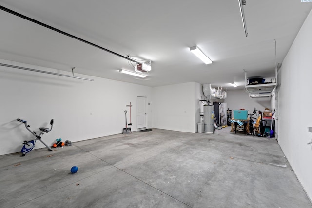 garage with strapped water heater and a garage door opener