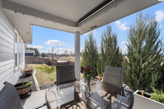 view of patio / terrace with outdoor dining area and fence