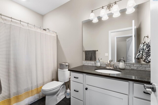 bathroom with toilet and vanity