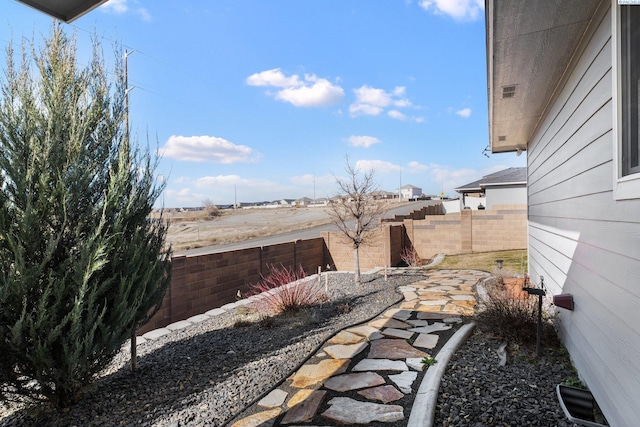 view of yard with a fenced backyard