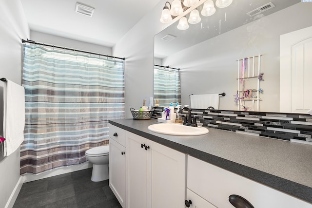 6416 Recurve Rd, Pasco, WA 99301 - full bath featuring toilet, vanity, decorative backsplash, and plenty of natural light